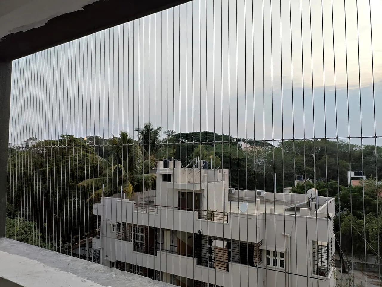 Invisible Balcony Grill Installation Professional Installation in Pullepady, Kerala by Deva Safety Nets